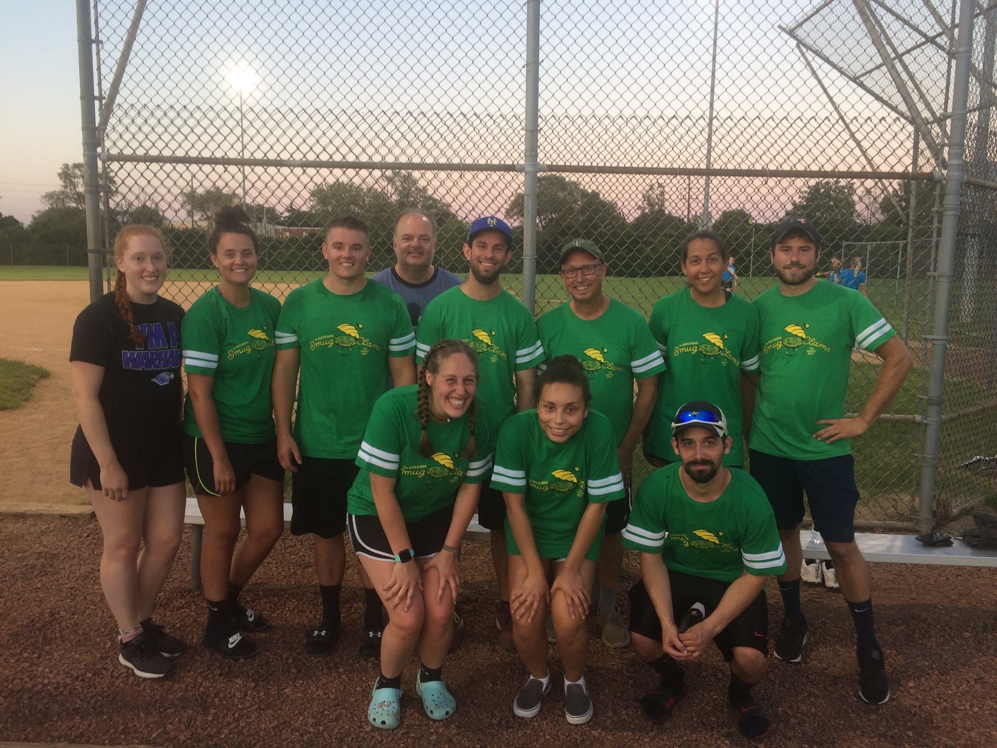 A rec softball team wearing their Smug Clam tshirts